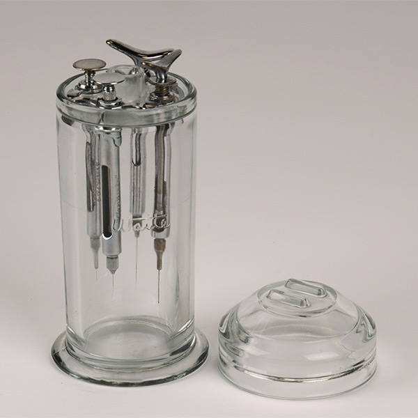 Syringe jar, 1950s, Cook-Waite Labs, Inc