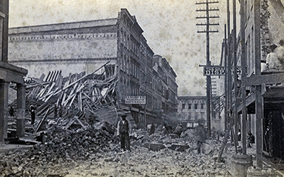 Black and white image of a ruined building on King Street, near Vanderhorst Street, in Charleston, South Carolina following, the Charleston earthquake in 1886.