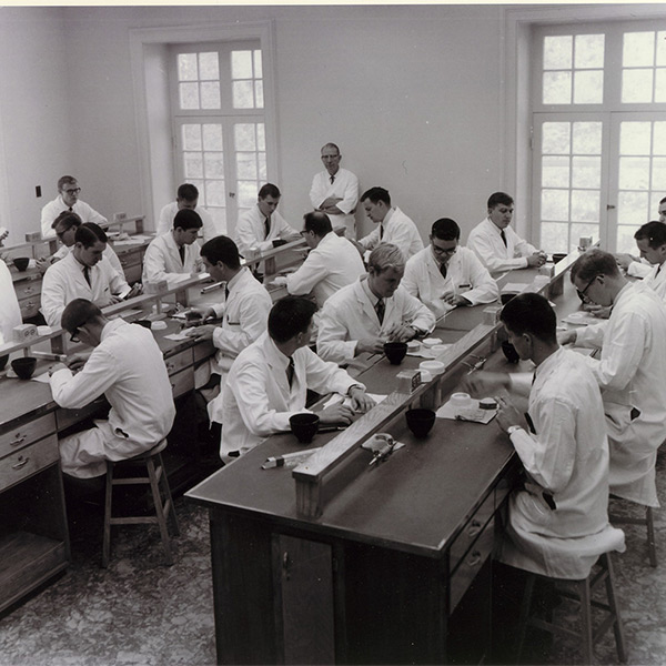 Dental students in the lab in Colcock Hall before the College of Dental Medicine building was completed in 1970